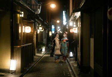 Geisha in the streets of Kyoto at night