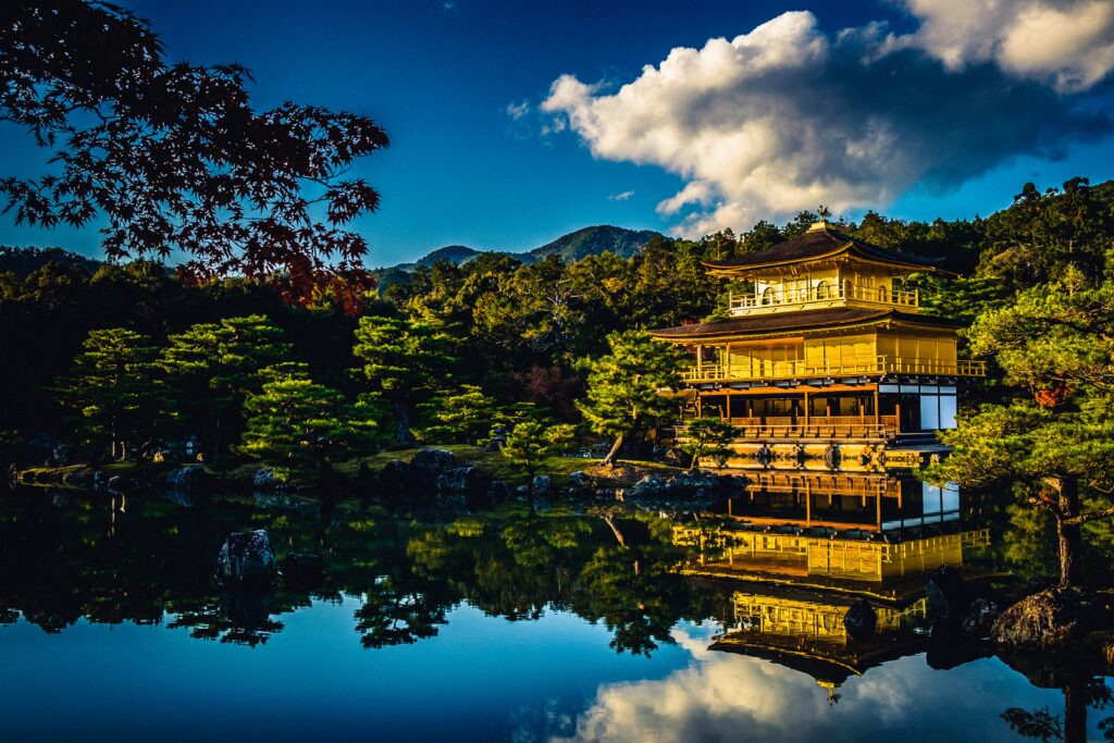 The iconic Golden Pavilion in Kyoto beautifully reflected on a still pond.